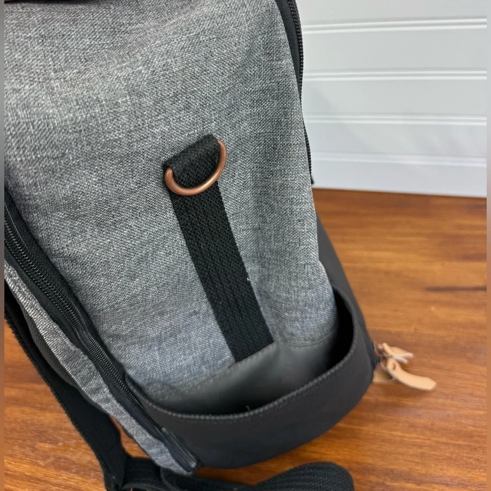 Petunia Pickle Bottom gray & black backpack shoulder diaper bag.